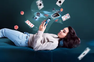 2777BET6 App — Fast, responsive, and optimized for all devices A cheerful woman in traditional clothing using her smartphone during a festive moment, showing how easily the 2777BET6 app fits into everyday life.