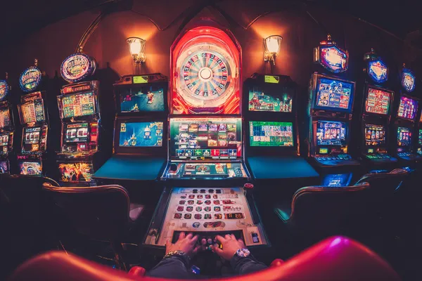 A close-up shot of golden coins falling around a spinning roulette wheel, representing immersive casino action at 2777BET6.