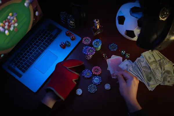 A glowing roulette wheel with cascading chips, symbolizing the engaging live and instant-win games available on 2777BET6.