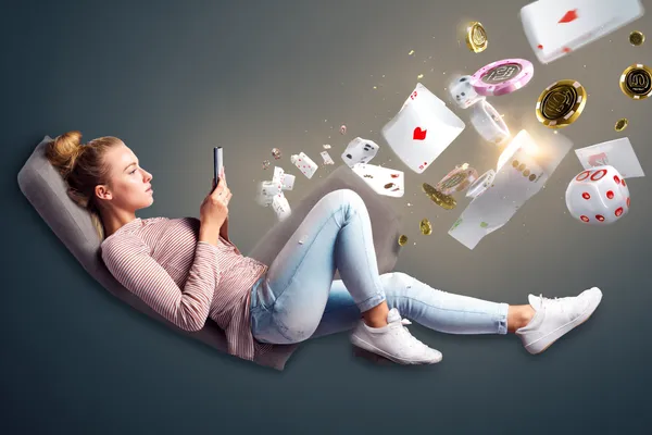 2777BET6 Mobile Casino — Play anytime, anywhere A player using their smartphone during a festive local event, representing 2777BET6’s fully mobile-friendly casino.